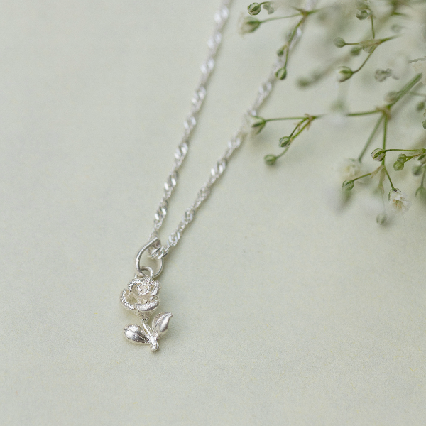 Rose with leaf pendant